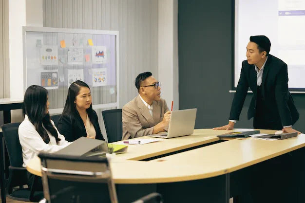 Business professionals having a meeting and presentation in a modern conference room